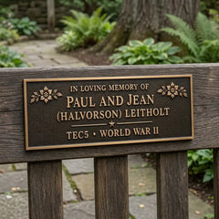 Memorial plaque for Paul and Jean (Halvorson) Leitholt in a garden setting.