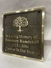 Bronze Memorial plaque with tree design and text on a white background