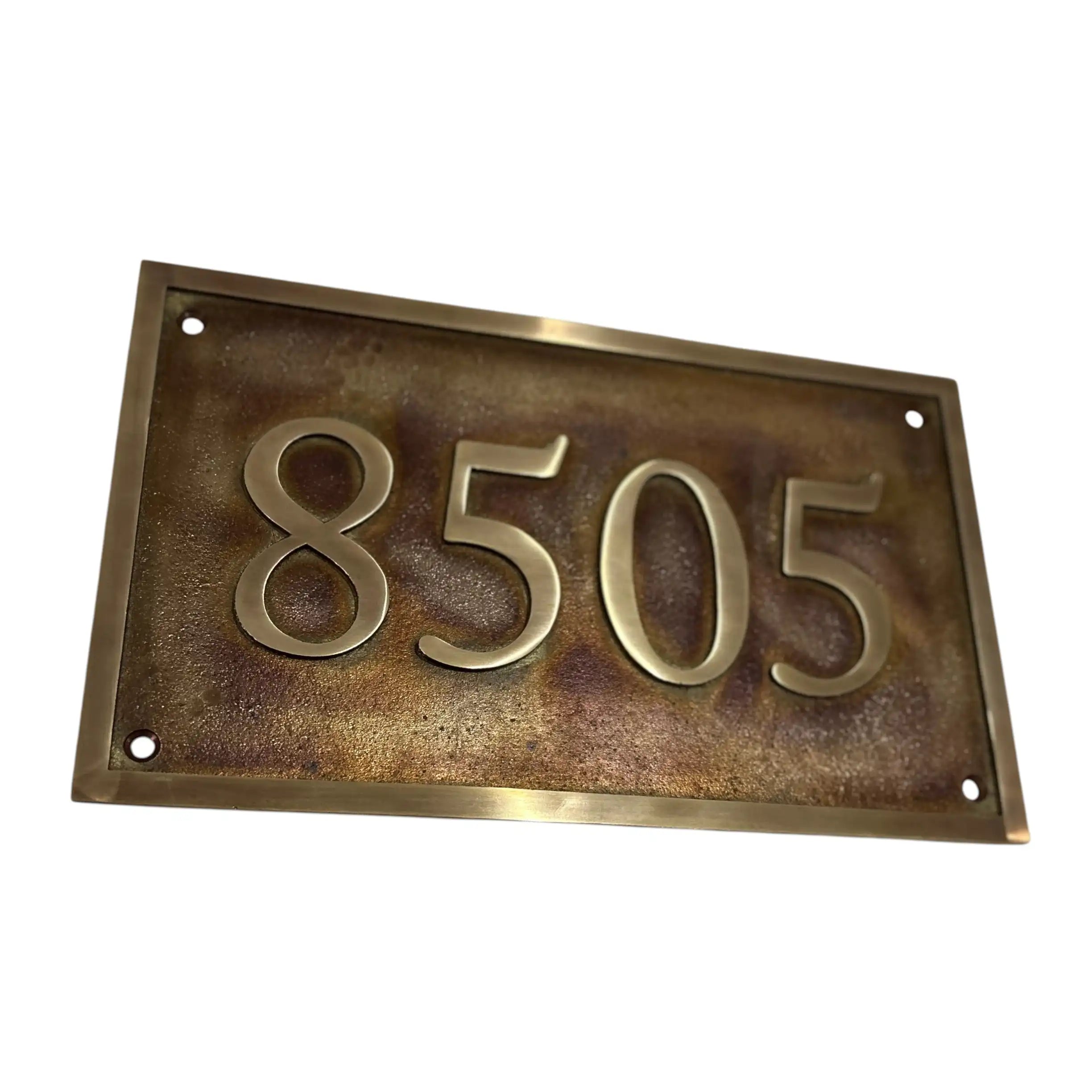 Rectangular metal house number plate with '8505' on a white background