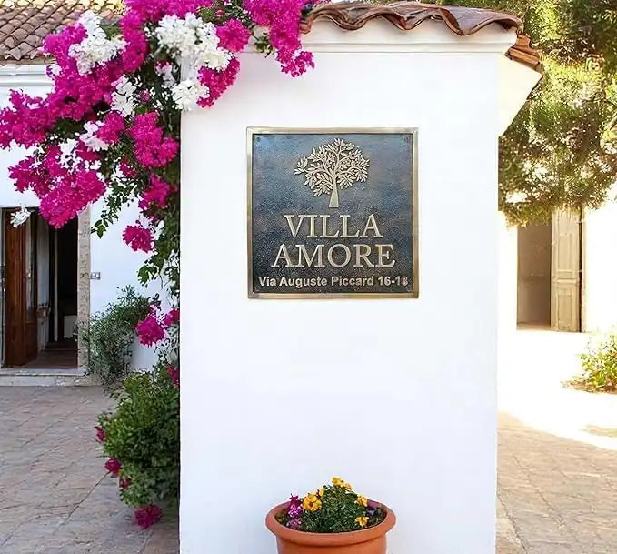 Bronze plaques Villa Amore entrance with floral decorations