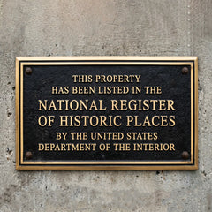 National register of historic place bronze plaque - Plaque on a concrete wall indicating listing in the National Register of Historic Places.