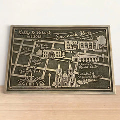 Personalized map plaque of Savannah, Georgia on a wooden surface with a white background
