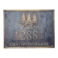 Bronze sign with trees and text '12881 CHATSWORTH LANE' on a textured background
