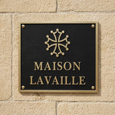 Bronze address plaques Maison Lavaille sign on a stone wall