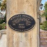 Historical Plaque on a stone column indicating 'Whitley Heights Built 1924' with a scenic illustration.