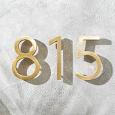 Solid brass floating house numbers with hidden stud mounting for modern house addresses, mailboxes, doors, and room numbering.