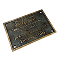 Memorial plaque with engraved text on a white background