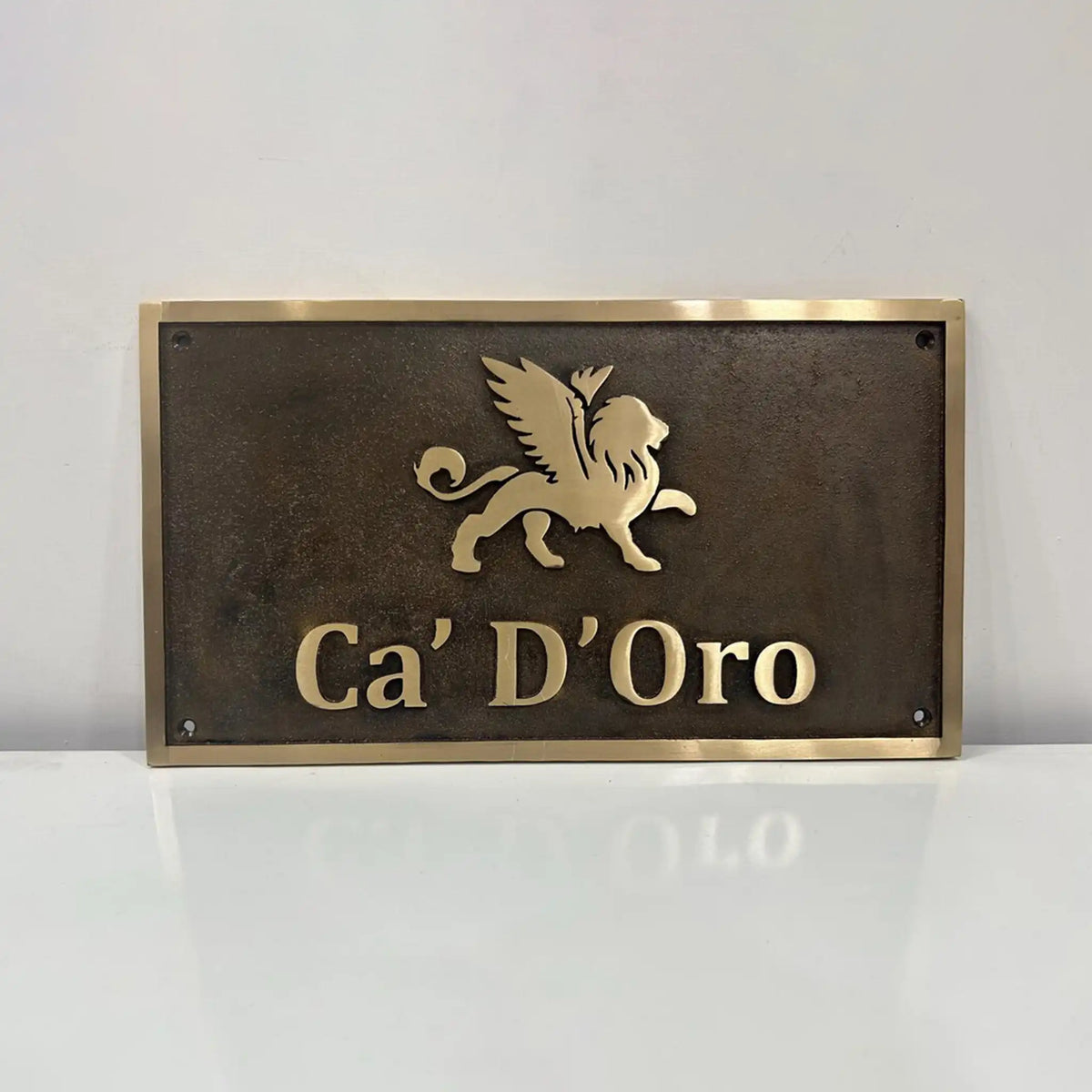 Custom bronze sign for outdoor use with custom text and logo