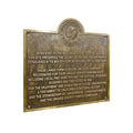 Bronze plaque with engraved text on a white background