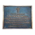 Memorial plaque with Celtic cross design on a blue background