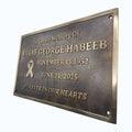 Memorial plaque for Ansaaf George Habeeb with a bronze finish on a white background