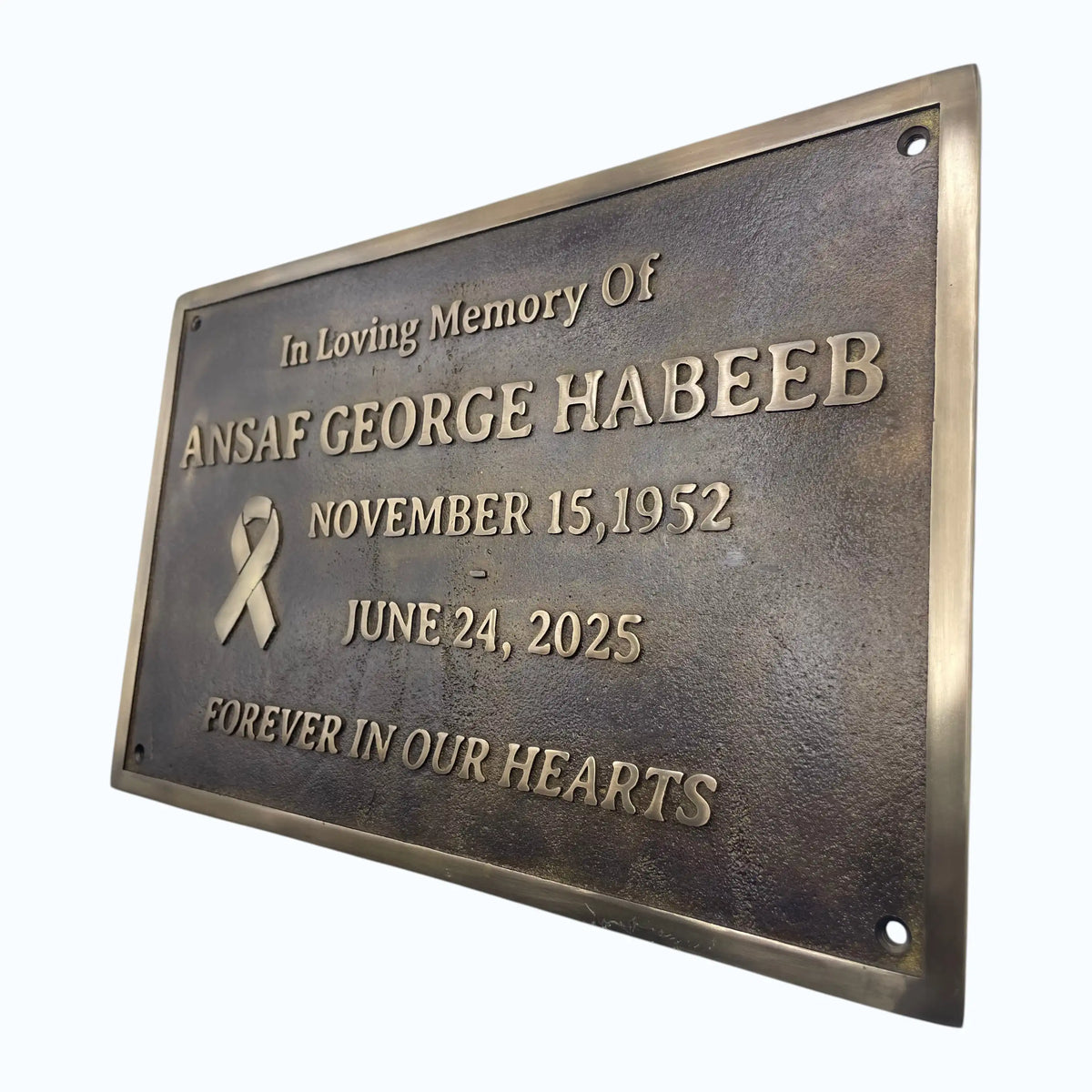 Memorial plaque for Ansaaf George Habeeb with a bronze finish on a white background