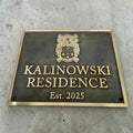 Address Plaque with 'Kalinowski Residence Est. 2025' on a concrete wall
