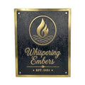 Bronze sign with 'Whispering Embers' logo and text on a black background