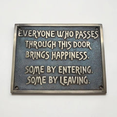 Personalized bronze plaque with motivational quote on a white background