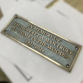 Memorial plaque for Jim Moffat on a white background