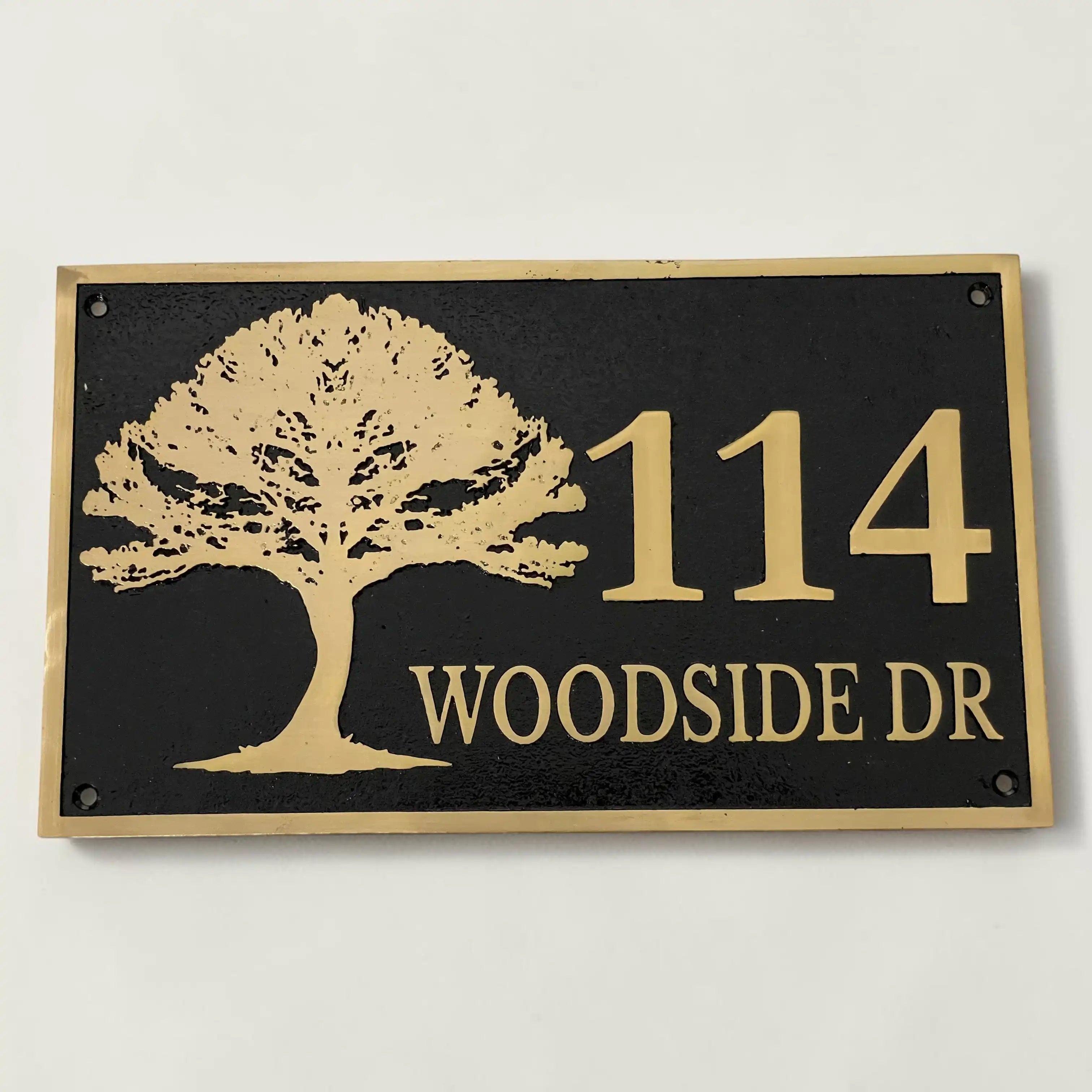 House number sign with tree design on a black background