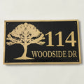 House number sign with tree design on a black background