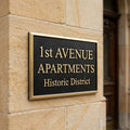 Address Sign for 1st Avenue Apartments in Historic District on a stone building.