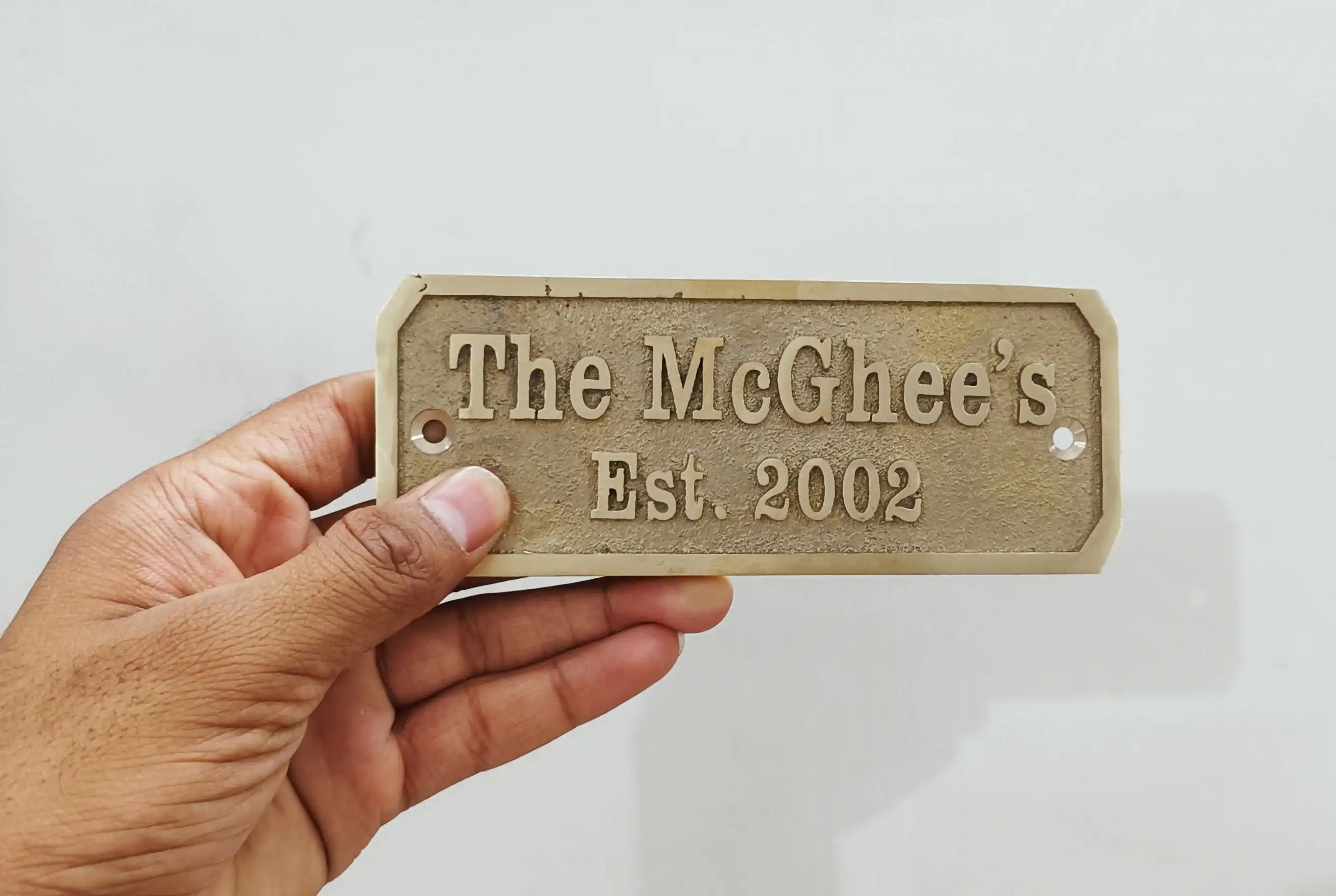 Custom brass door sign made from solid cast brass