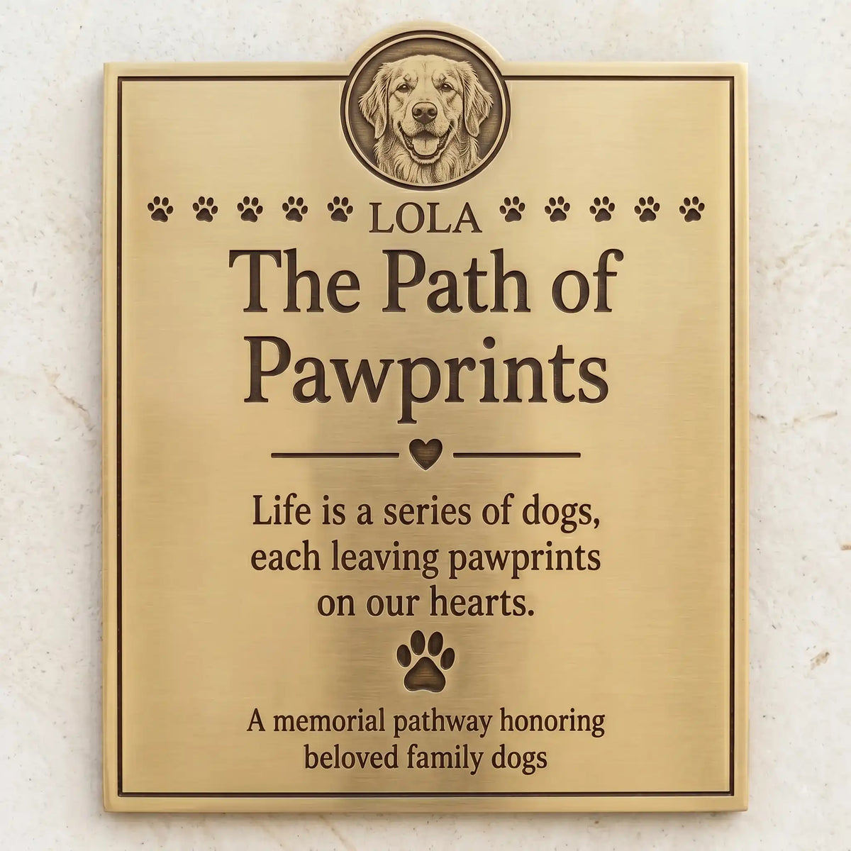Memorial plaque for dogs with engraved text and a dog's face, on a light background.