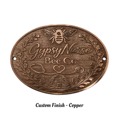 Bronze plaque with 'Gypsy Nurse Bee Co' text and bee design on a white background