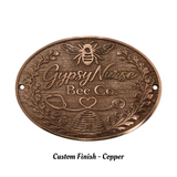Bronze plaque with 'Gypsy Nurse Bee Co' text and bee design on a white background