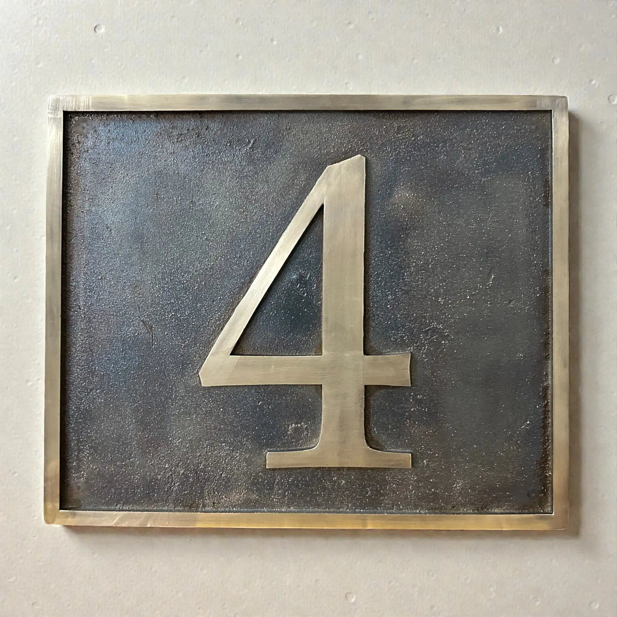Custom bronze address plaque with antique finish and raised numerals