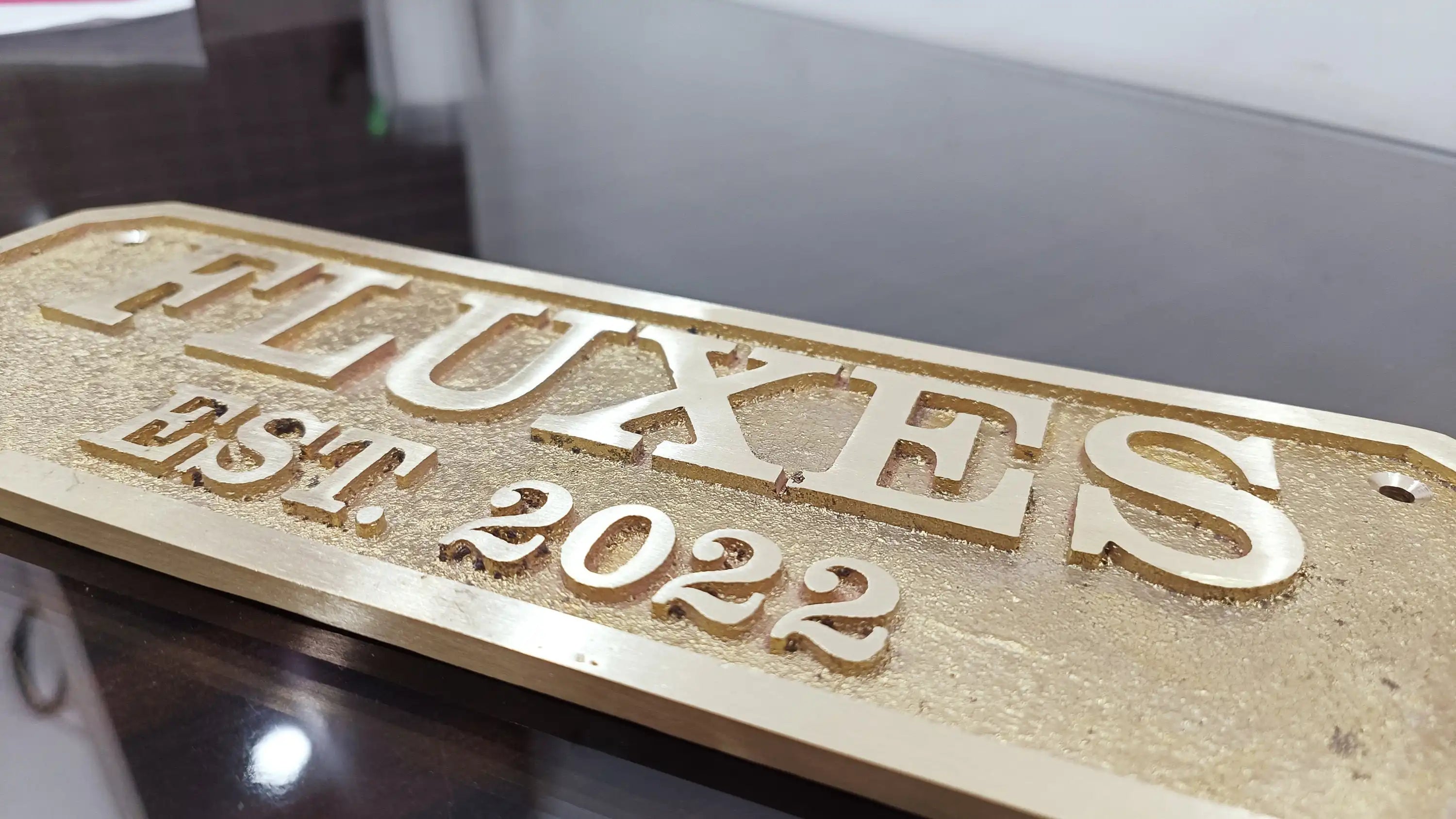 Custom cast brass nameplate for door installation