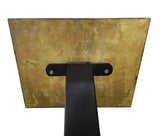 Gold metal bracket with black support on a white background