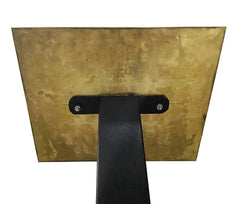 Gold metal bracket with black support on a white background