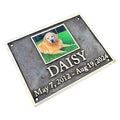Memorial plaque for a dog named Daisy with a photo and dates on a white background
