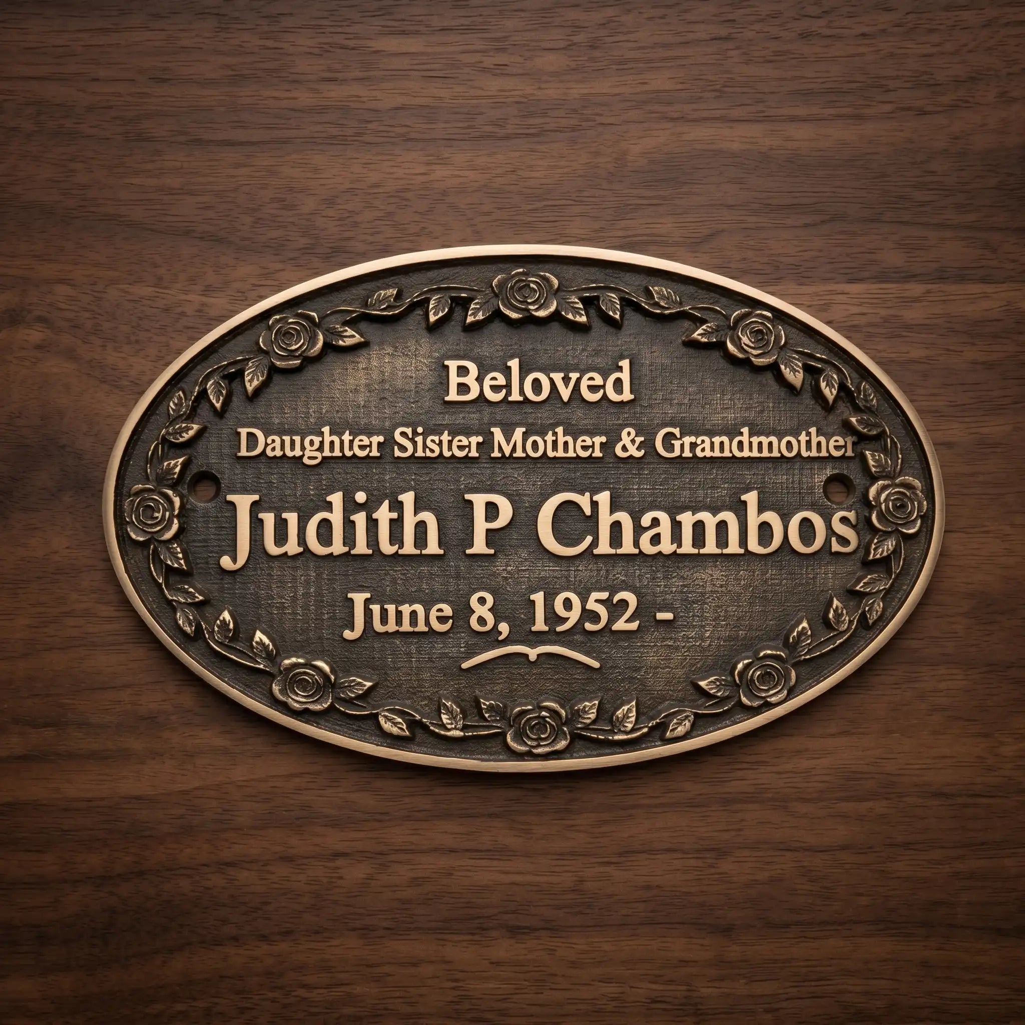 Bronze plaque with engraved text on a wooden background