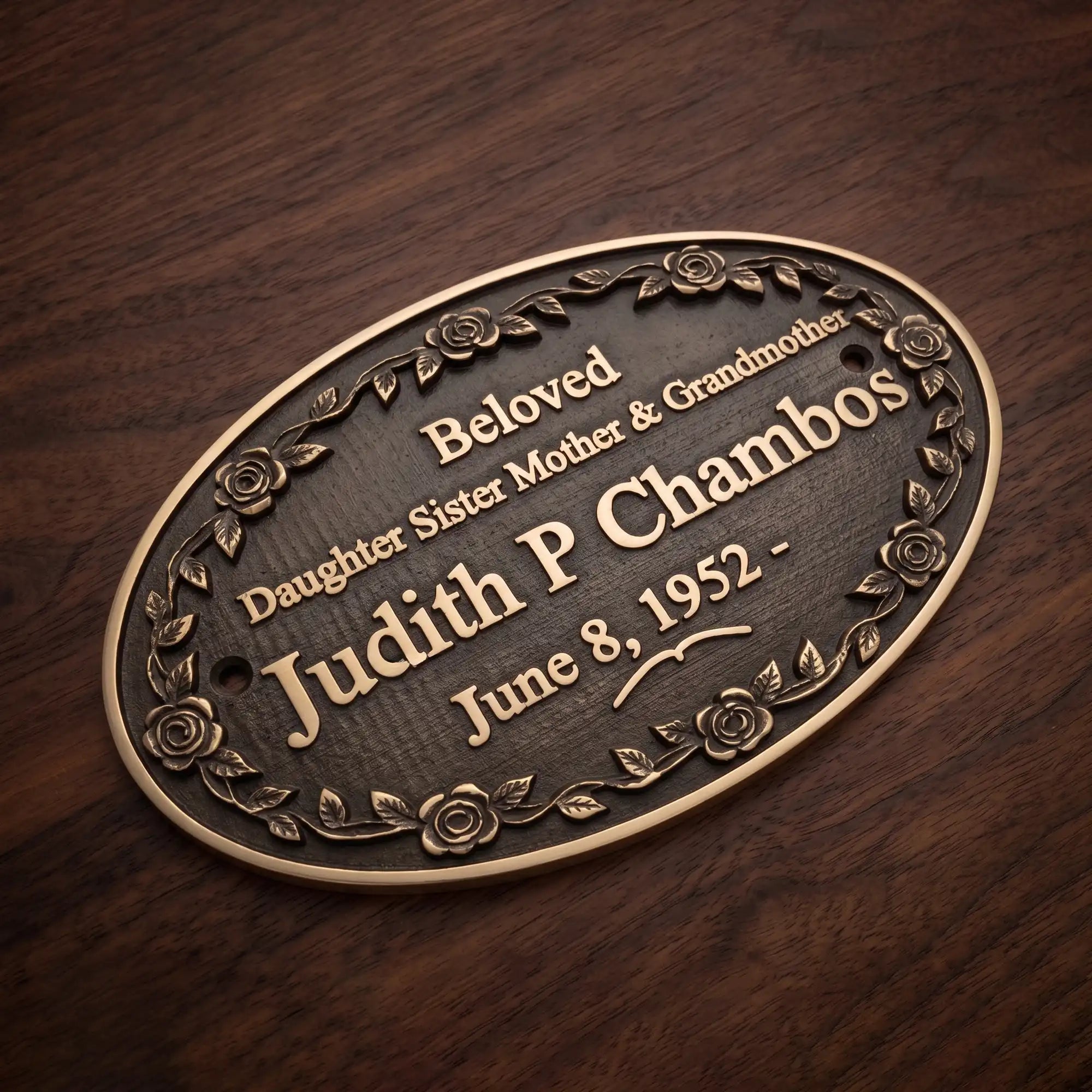 Bronze plaque with engraved text on a wooden background