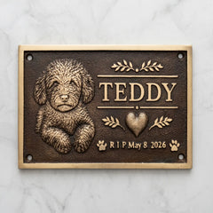 Bronze Memorial plaque for a dog named Teddy with a heart and dates on a marble background