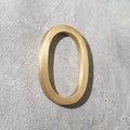 Solid brass address numbers with floating hidden stud mounting for modern home exteriors and entryways.